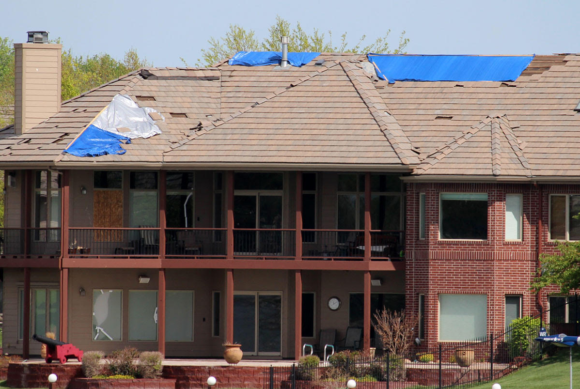 a powerful microburst destroyed a bulk of the roofs in a subdivision