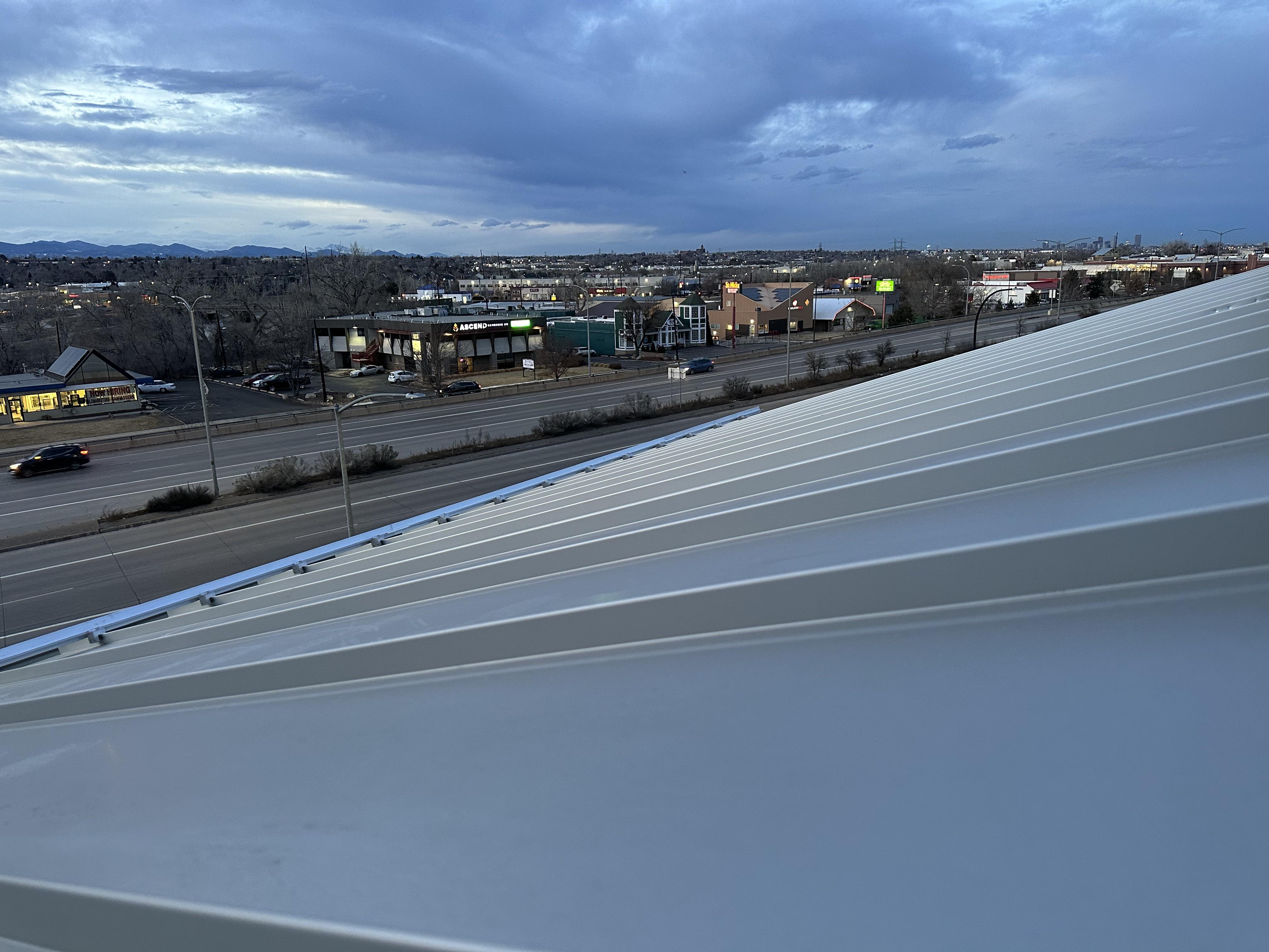 Rocky Mountain - On Point Contracting installation of S-5! ColorGard with S-5! S clamps and evergreen colorstrips at WoodSprings Hotel
