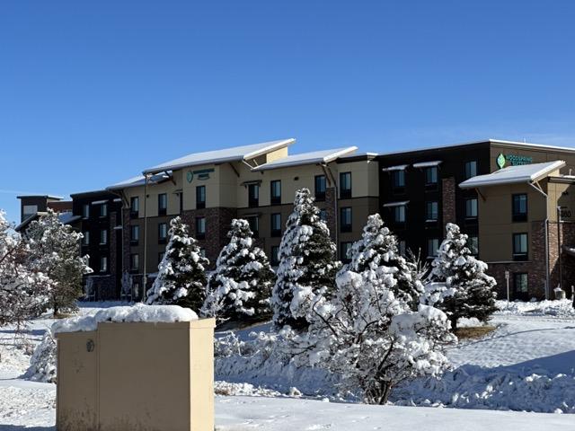 Rocky Mountain - S-5! ColorGard with S-5! S Clamps and evergreen color strips on metal snap lock roof on the WoodSprings Suites Hotel