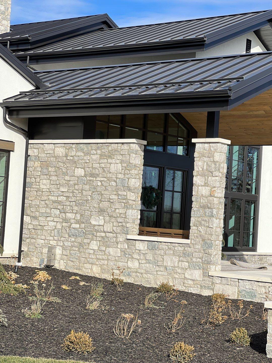 Rocky Mountain - S-5! ColorGard with S-5! E clamps and dark bronze color strips on standing seam metal roof installed by White Castle Roofing