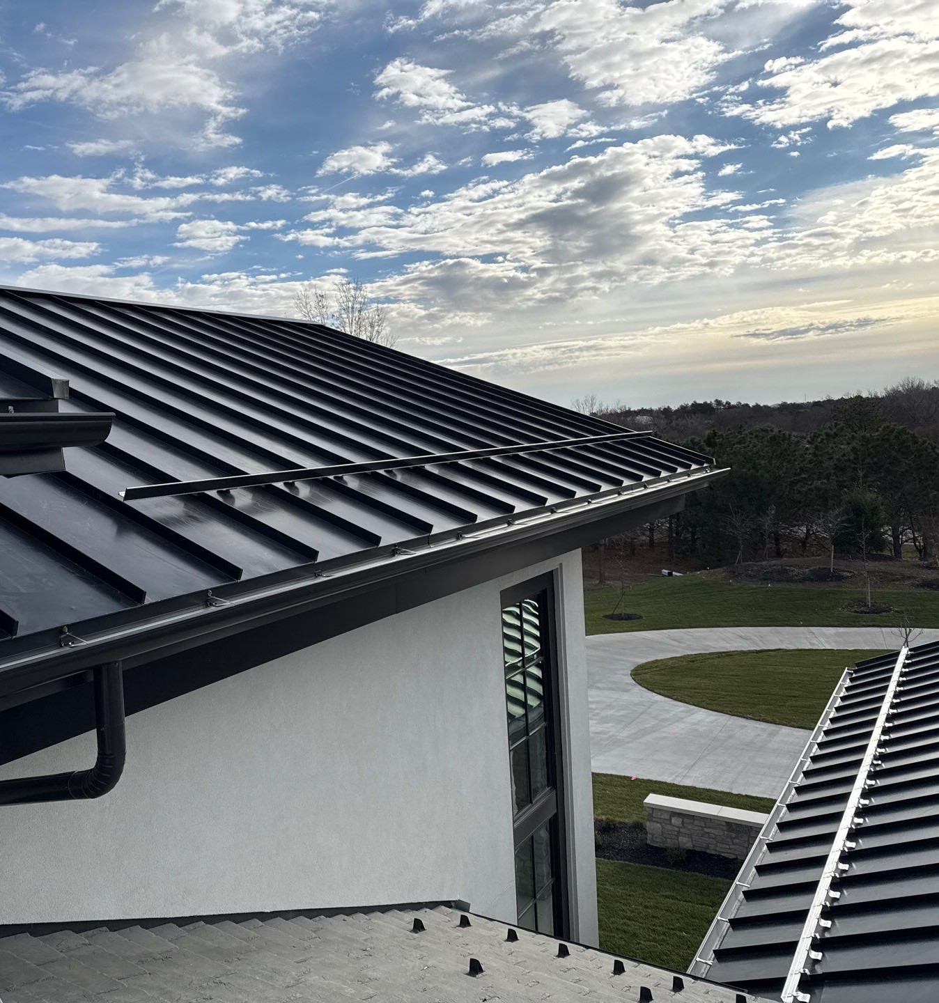 Rocky Mountain - S-5! ColorGard with S-5! E clamps and dark bronze color strips on standing seam metal roof installed by White Castle Roofings