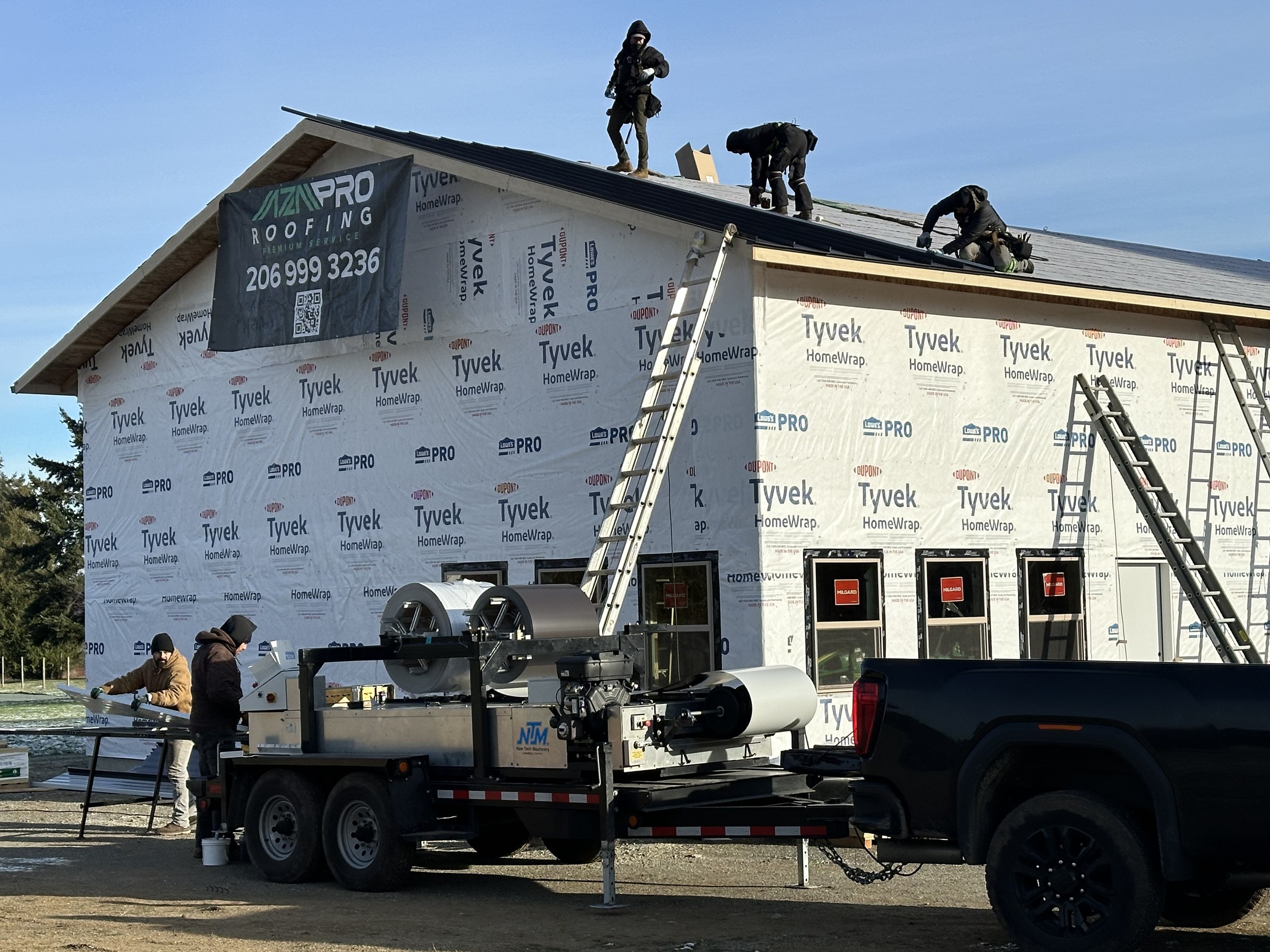 Our crew fabricating standing seam panels on site with our New Tech Machinery roll former Our crew fabricating standing seam panels on site with our New Tech Machinery roll former