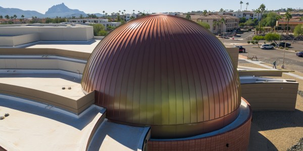 Custom curved ATAS panels atop one-of-a-kind Discovery Center pr photo